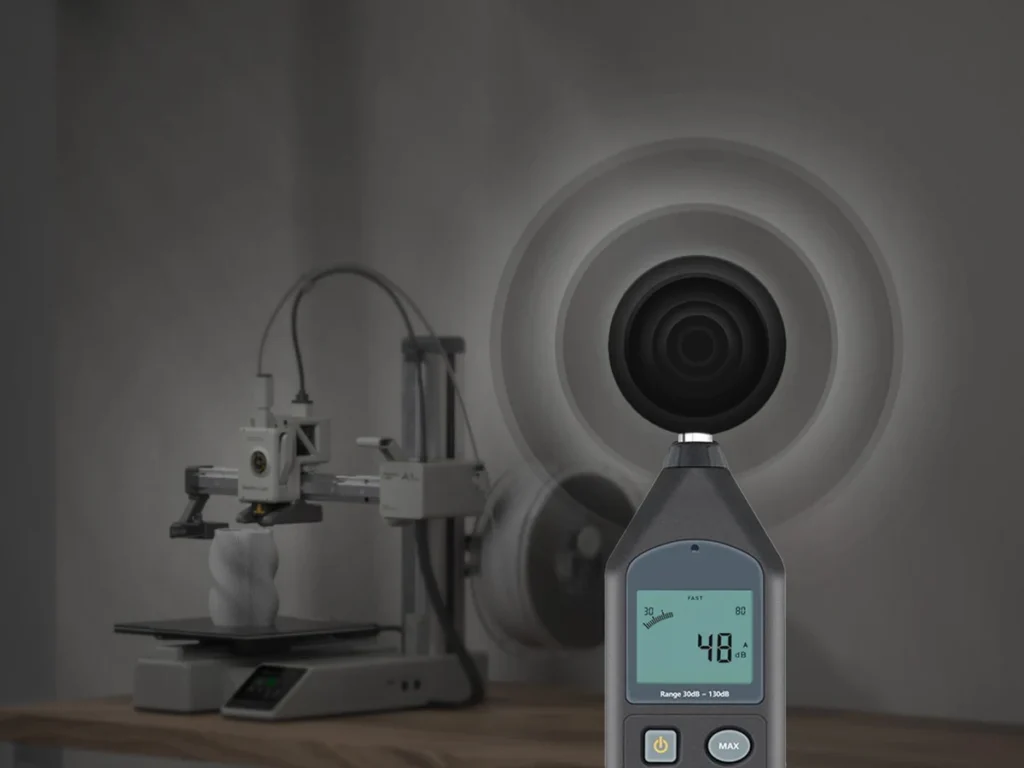 Шумомер показывает 48 дБ рядом с Bambu Lab A1 mini, рендер производителя