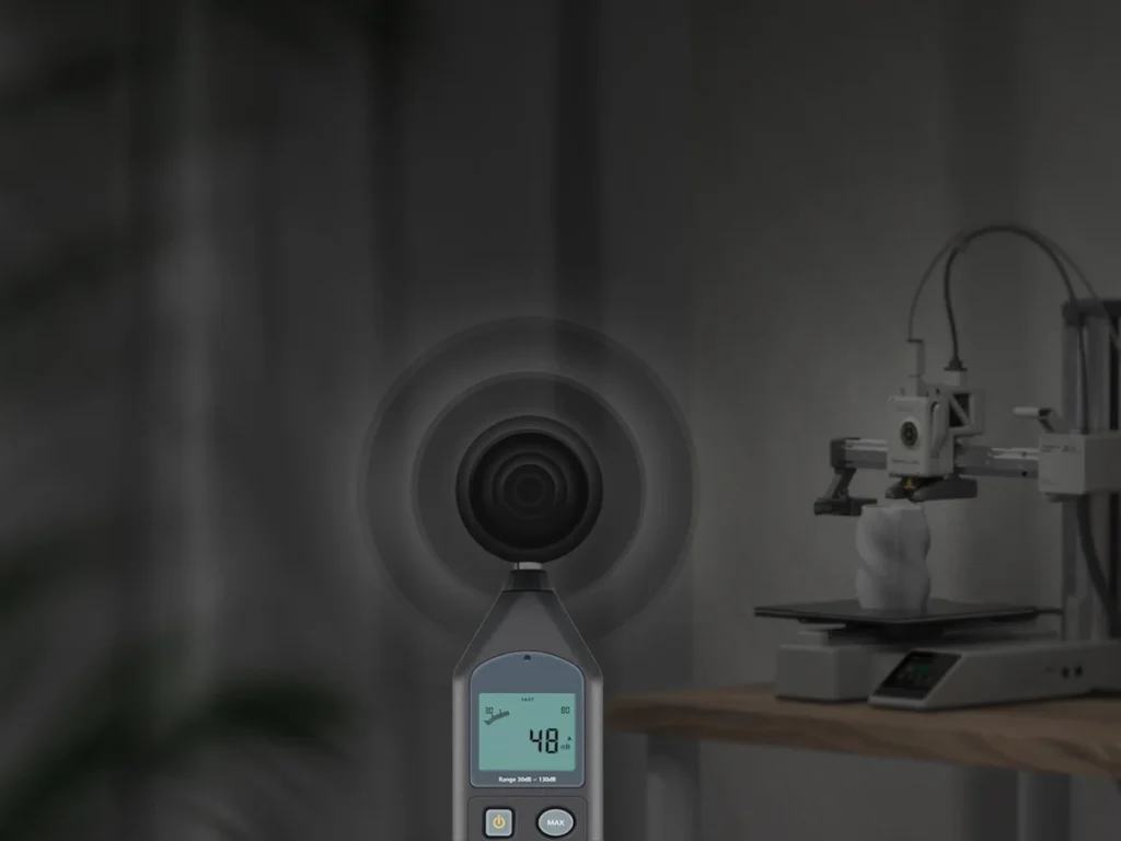 Шумомер показывает 48 дБ рядом с принтером Bambu Lab A1 mini, рендер производителя